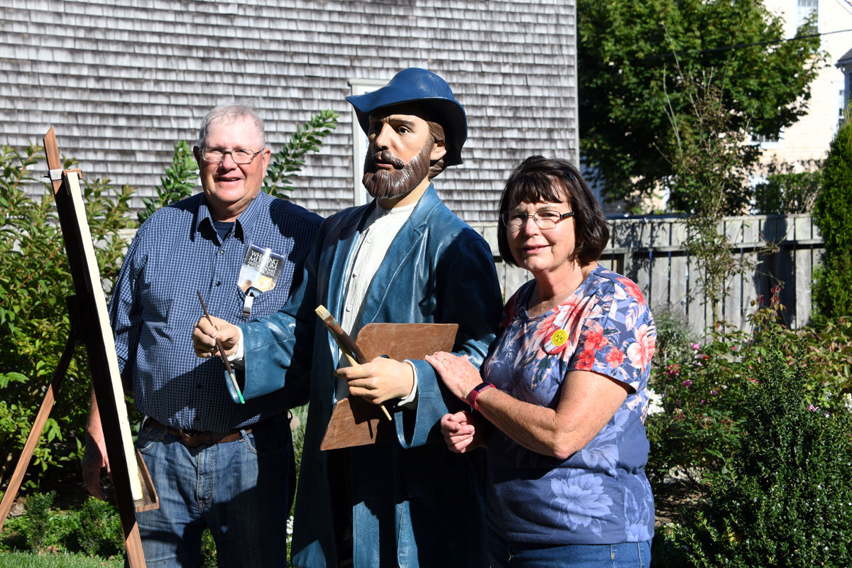 119 Curt and Mary Folkerts pose with a Seward Johnson sculpture of Claude Monet on display in the Hadwen House garden.jpg